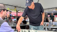 What's it like to face an international chess master? 74 people in Hamilton took on Brian Hartman