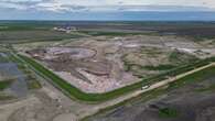 How does Saskatoon's successful landfill search compare to the one planned in Manitoba?