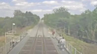 Video shows 3 people running on bridge beside Kitchener GO train as crew initiates emergency brakes