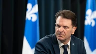 Quebec's former transport minister says he was kept in the dark about SAAQclic cost overrun