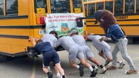 Pushing school buses to send London kids to summer camp