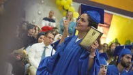At this adult high school, 6 siblings celebrate graduation while a mom accepts her daughter's diploma