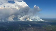 Firefighters trapped in remote northern Alberta as wildfires rage across the province