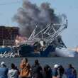 Preliminary report issued into Baltimore bridge collapse as crew languishes aboard ship