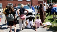 Angry protesters surround N.S. premier Houston's car, smash windshield
