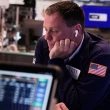 Global stock markets wobble while China-U.S. trade spat continues