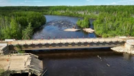 New temporary bridge built in Pinehouse, Sask., after main bridge collapse