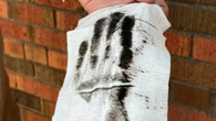 People in several Hamilton neighbourhoods still don't know why black soot has been falling on their homes
