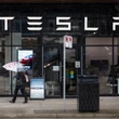 Tesla being investigated after car drives into home, killing 76-year-old woman