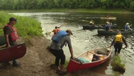 Over 100 people paddle to protest Sisson Mine