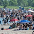 Heat wave hits central Canada, as western provinces grapple with floods