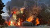 Winnipeg firefighters attack flames of burning North Point Douglas house on Sunday morning