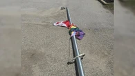Police investigating after flagpoles flying Pride flag cut down in Perth County
