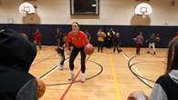 Students at a Thunder Bay public school shoot hoops with an Olympic basketball player