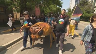Protestors march through downtown Toronto to call out corporate landlords