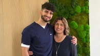 His mom survived cancer. Now, this student is doing a triathlon in scrubs to give back