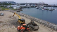 Piles of dirt removed from Grand Manan shore after blocking harbour views for years