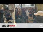 Assad's soldiers give up their weapons in Syrian 'reconciliation centres' | BBC News