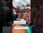 Children gather for food rations in Gaza camp