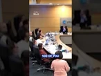 Moment when councillor meeting erupts into chaos