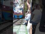 Train narrowly misses tourists in Vietnam