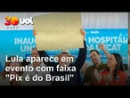 Lula aparece em evento segurando faixa 'Pix é do Brasil'; veja