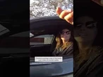 Woman accused of driving with phone in missing hand