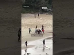 Video appears to show shark chasing boy in waters of Australian beach