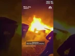 Bodycam video captures the moment Arizona police officers run into burning home.