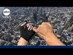 Daredevils climb to top of the Empire State Building, display banner before proposal