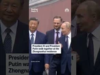 Presidents Xi Jinping and Vladimir Putin walk together at the Zhongnanhai residence