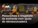 Motociclista é resgatado por retroescavadeira durante temporal em Belo Horizonte; veja vídeo