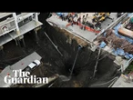 Sinkhole swallows part of street in front of Bangkok hospital