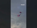 WATCH: Patriot parachute team soars GIANT American flags into Cody Stampede Rodeo