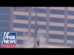 ENGAGEMENT to ARREST: Couple scales Empire State building spire