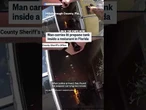 Man carries lit propane tank into Florida restaurant