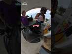 Angry woman confronts biker after he pulled into gas station