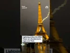 Lightning strikes the Eiffel Tower as a thunderstorm rages over Paris