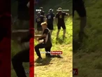 German YouTuber Tom Kopke wins first men's annual cheese-rolling race. #CoopersHill #BBCNews