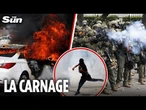 Riots rock LA as protesters set cars on fire & hurl missiles at cops in violent anti-ICE clashes