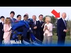 Italian PM Meloni guides Biden back to G7 photo op after he wandered away during parachute display