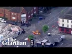 Aerials from Belfast during anti-immigration protest following knife attack – watch live