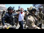 Law enforcement officials announce criminal charges over protests – watch live