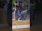 Moment ruthless Putin soldier threatens woman at gunpoint outside Russian restaurant