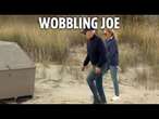 Moment Joe Biden stumbles on sandy beach as Jill struggles to keep him up during day out in Delaware