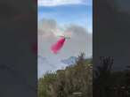 Large airtanker struggles to fly and drop fire retardant on Pacific Palisades wildfire