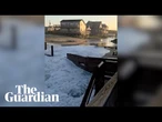 Footage shows houses battered by waves during Hurricane Erin