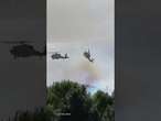 Moment choppers nearly COLLIDE fighting wildfire