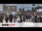 Gaza warehouse broken into by 'hordes of hungry people', says WFP | BBC News