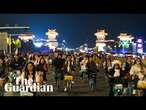 Thousands of Chinese students take part in night cycle ride in search of dumplings